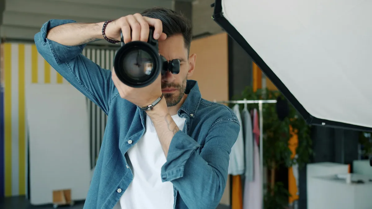 Jackson Reed with his camera in the Gowanus studio