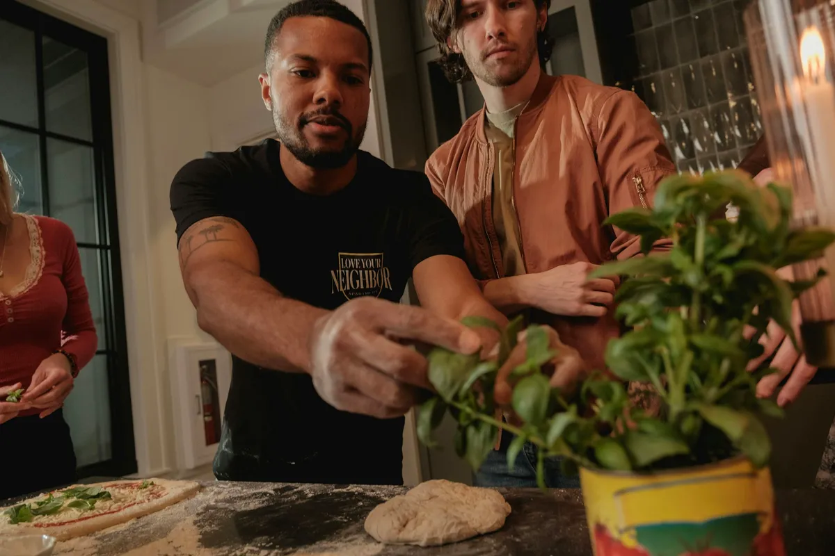 Friends making pizza at a supper club in Clinton Hill