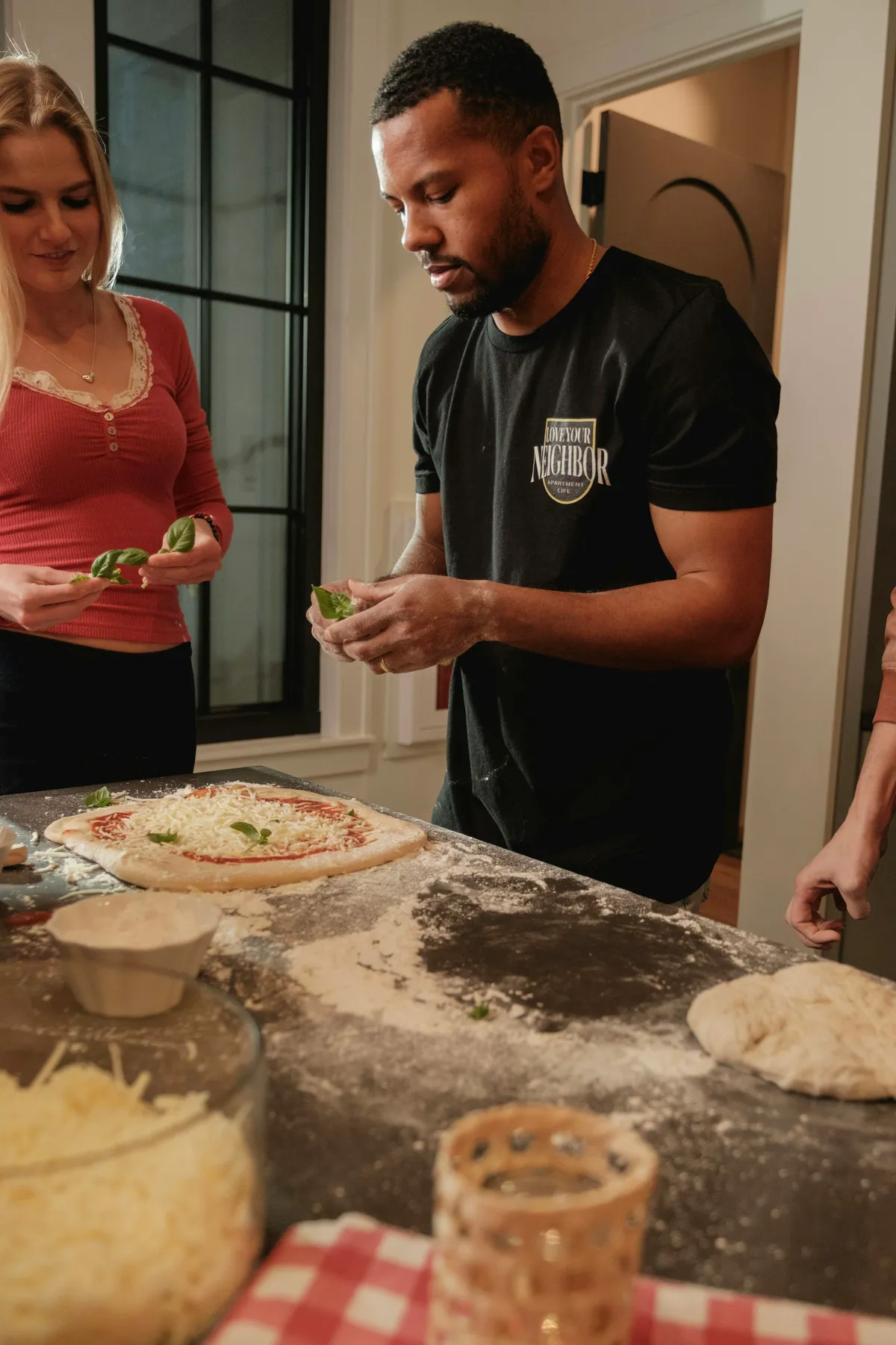 Friends making pizza at a supper club in Clinton Hill