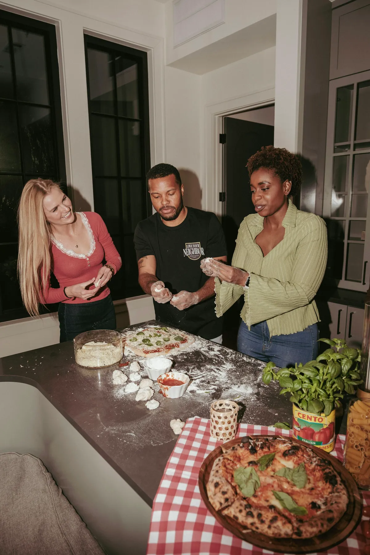Friends making pizza at a supper club in Clinton Hill
