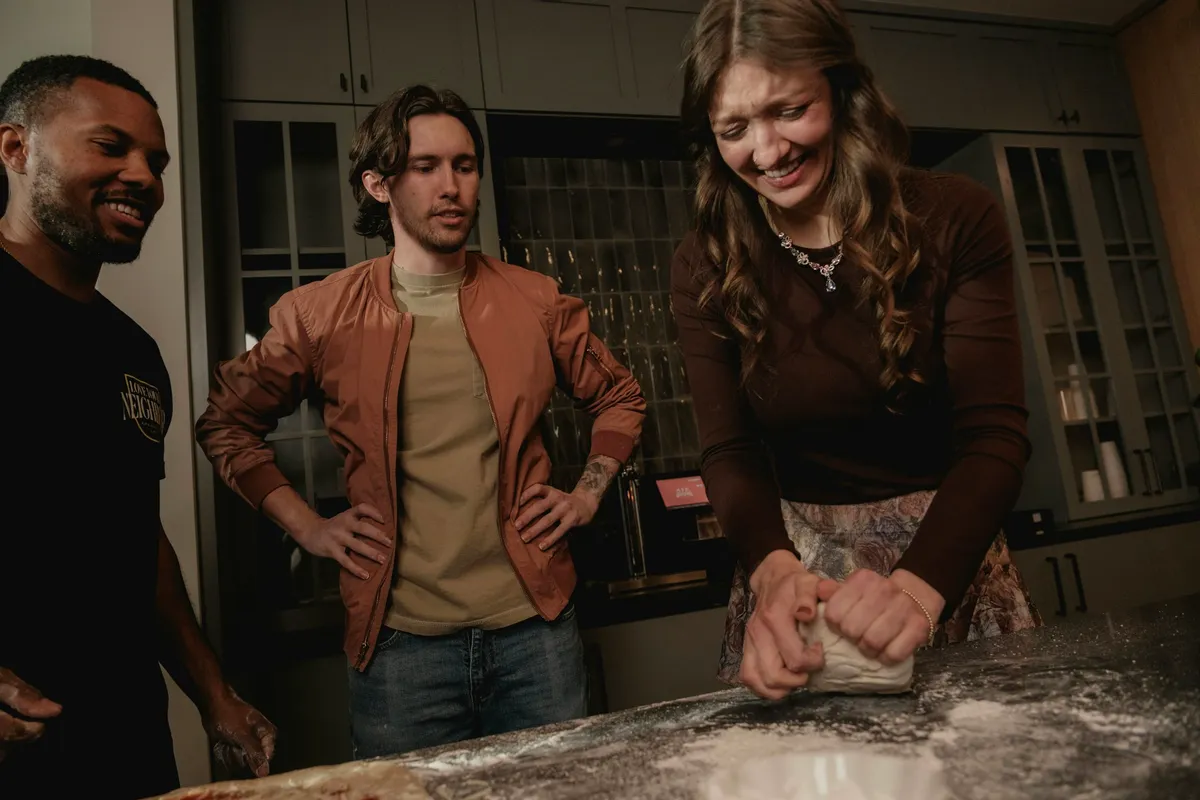 Friends making pizza at a supper club in Clinton Hill
