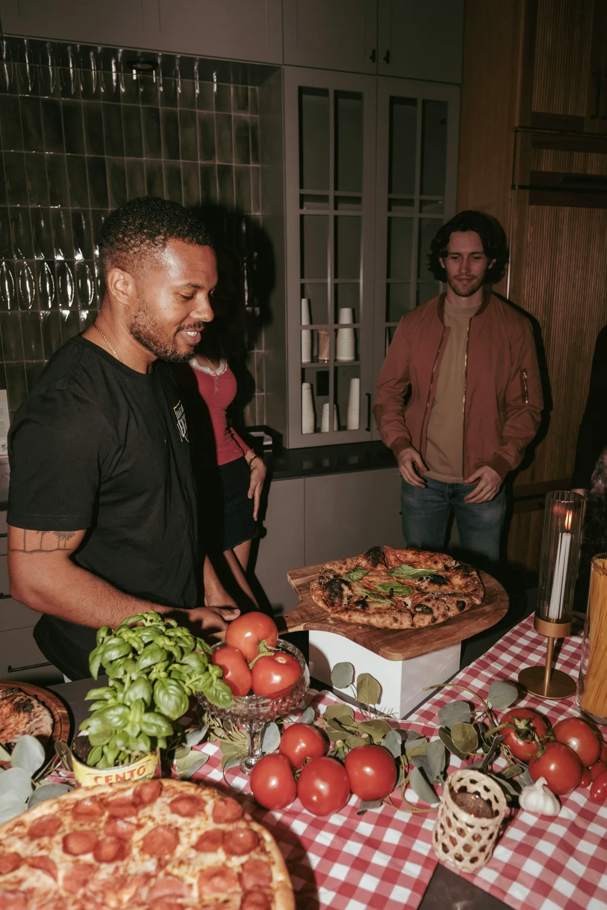 Friends making pizza at a supper club in Clinton Hill